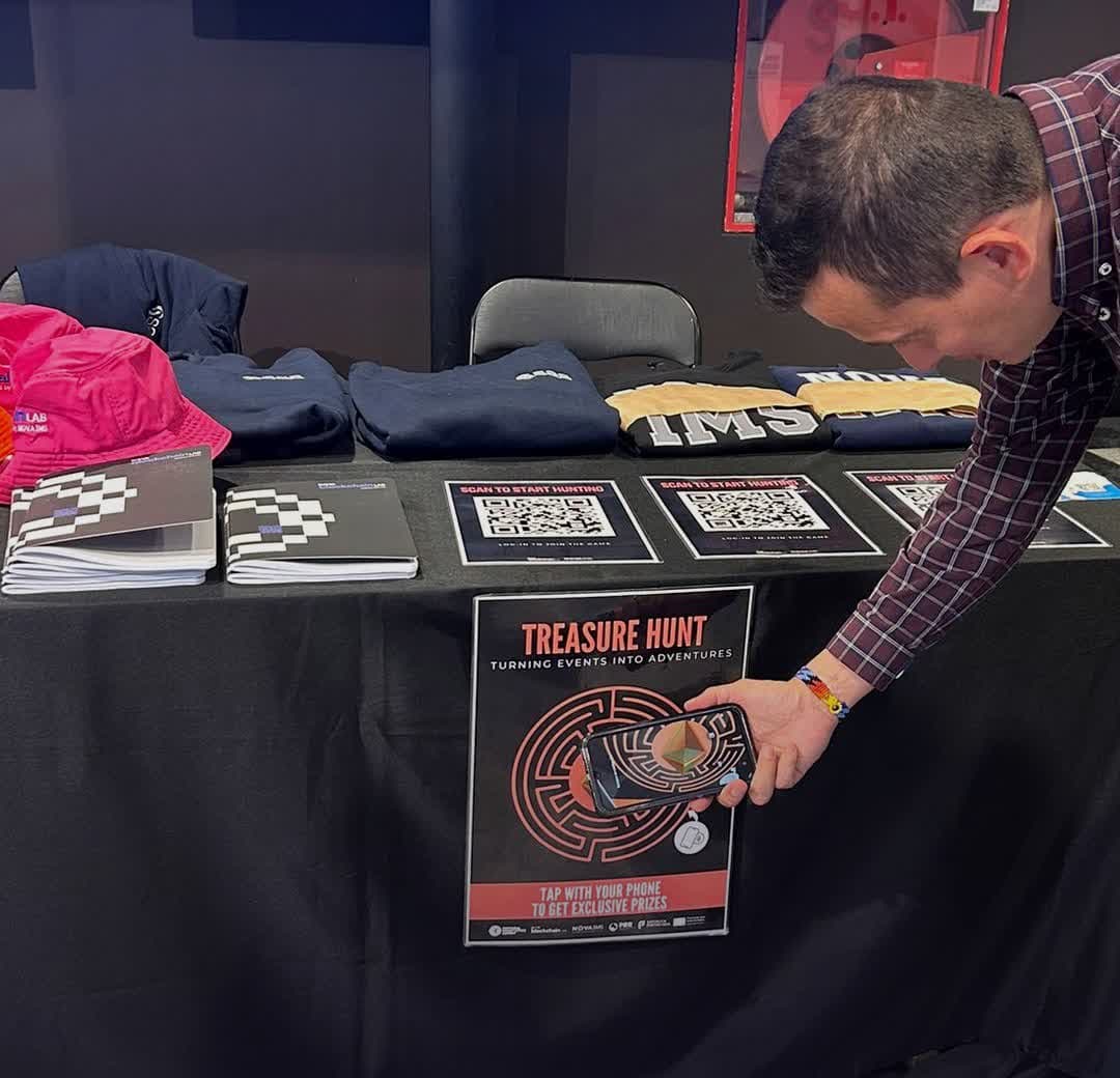 Attendee tapping their phone on a Treasure Hunt poster at the Data with Purpose Summit